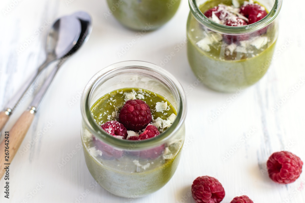 White chocolate cream mousse with matcha, avocado, pistachio, fresh raspberries - healthy vegan dairy free, gluten free White chocolate cream mousse with matcha, avocado, pistachio, fresh raspberries - healthy vegan dairy free, gluten free