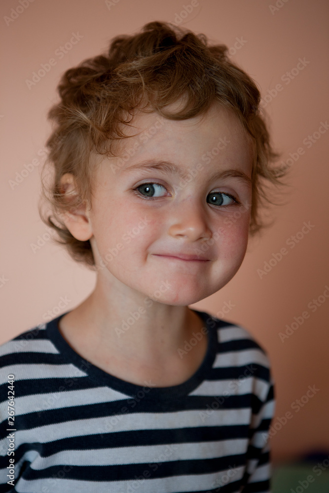 A little curly-haired girl with a cunning curious look, conceived a prank. A little curly-haired girl with a cunning curious look, conceived a prank.