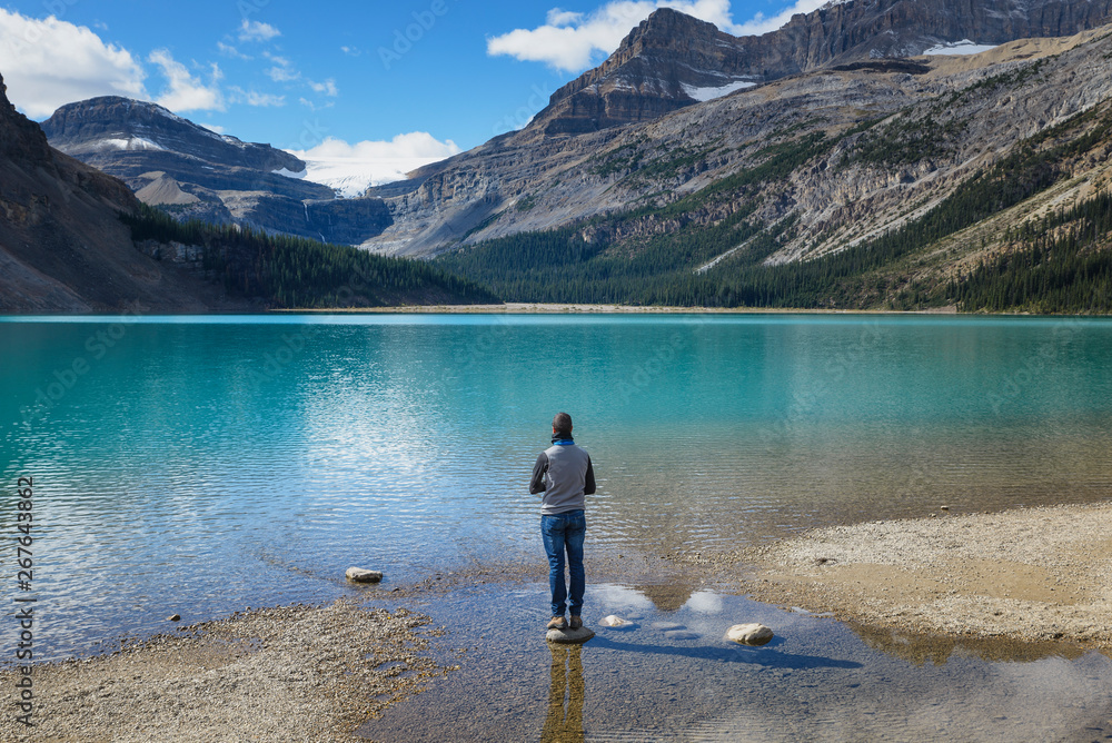 Canada, Jasper and Banff National Park, Icefields Parkway, man at lakeside Canada, Jasper and Banff National Park, Icefields Parkway, man at lakeside