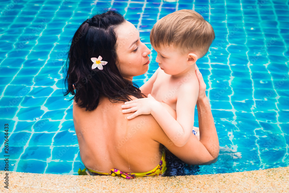 Mom and son in the pool.