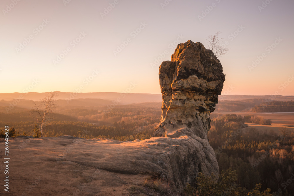 Capska palice rock above the deep forests with sunrise, Kokorinsko Czech