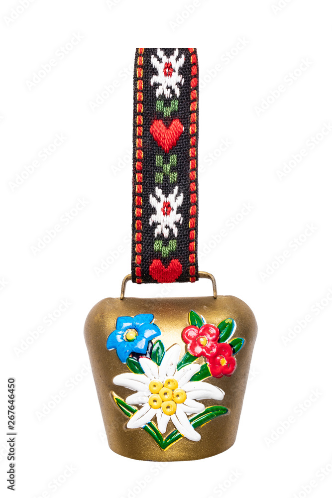 Switzerland souvenir. Closeup of colorful swiss cow bell with Edelweiss and  gentian isolated on a white background. Macro. Stock Photo | Adobe Stock