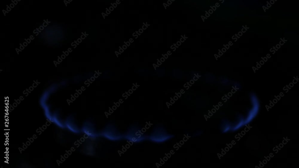 Cooker Stove Burner Image in Dark with Big Blue Flames Decreasing Cooker Stove Burner Image in Dark with Big Blue Flames Decreasing