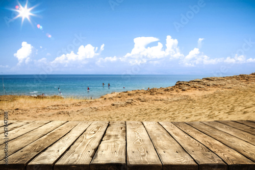 Summer day and wooden table background of free space. 