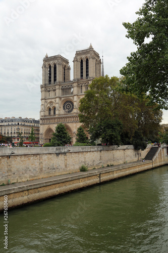 facade of Basilica of Notre Dame de Paris with Seine River befor