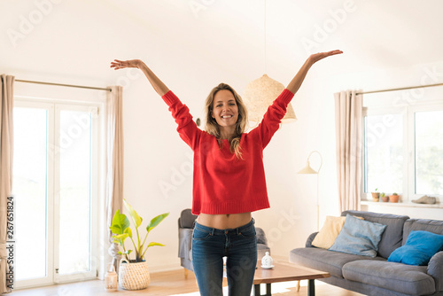 Portrait of carefree woman at home photo