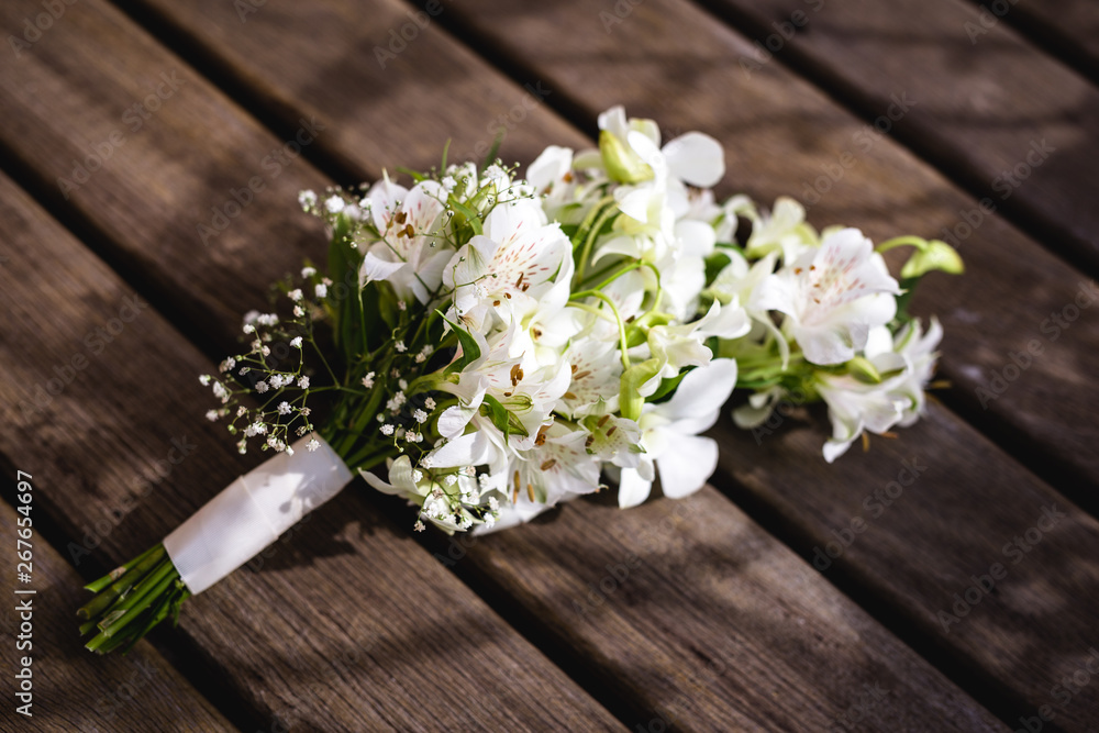wedding bouquet on wooden table, rustic bouquet for bride. wedding bouquet on wooden table, rustic bouquet for bride.