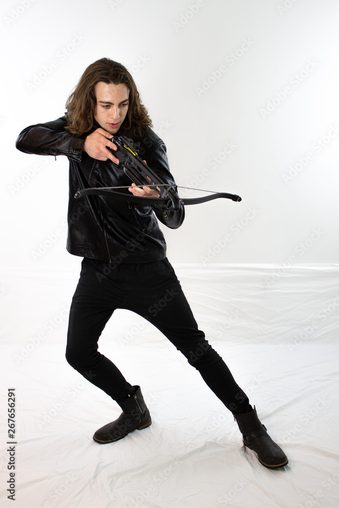 Mysterious hunter in black leather with bow Mysterious hunter in black leather with bow