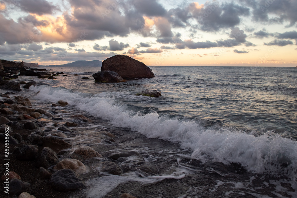 Sunset on a wild beach on sea Sunset on a wild beach on sea