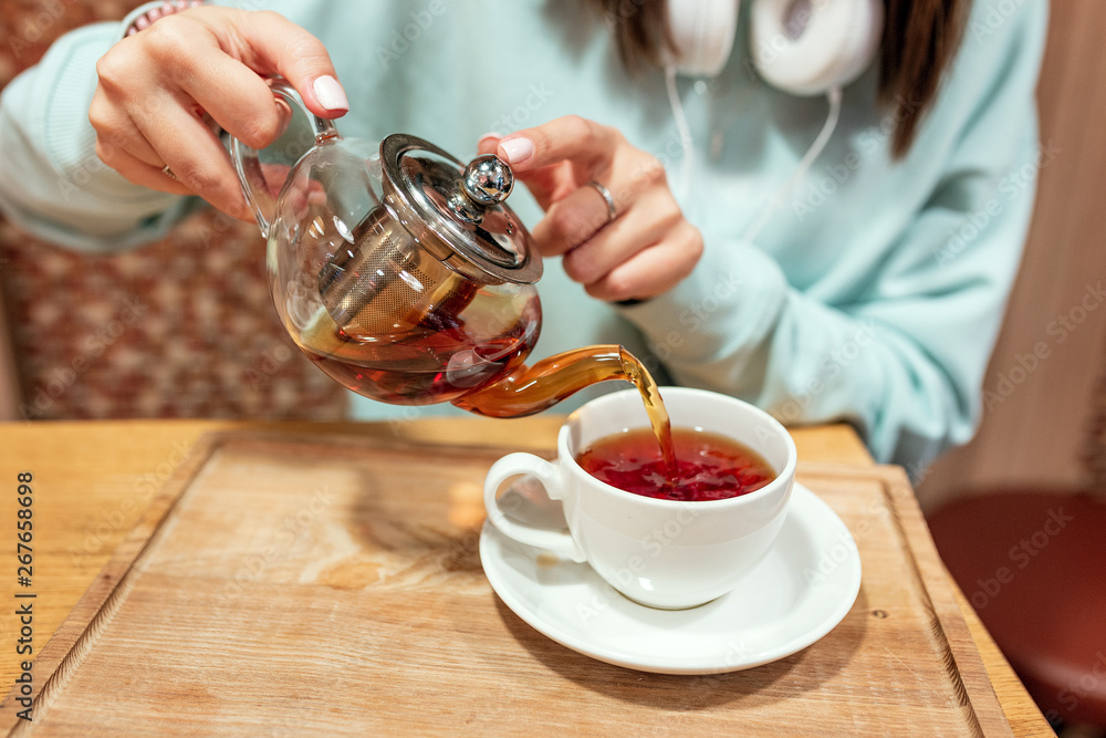 Happy asian woman drinking tea in cafe Happy asian woman drinking tea in cafe