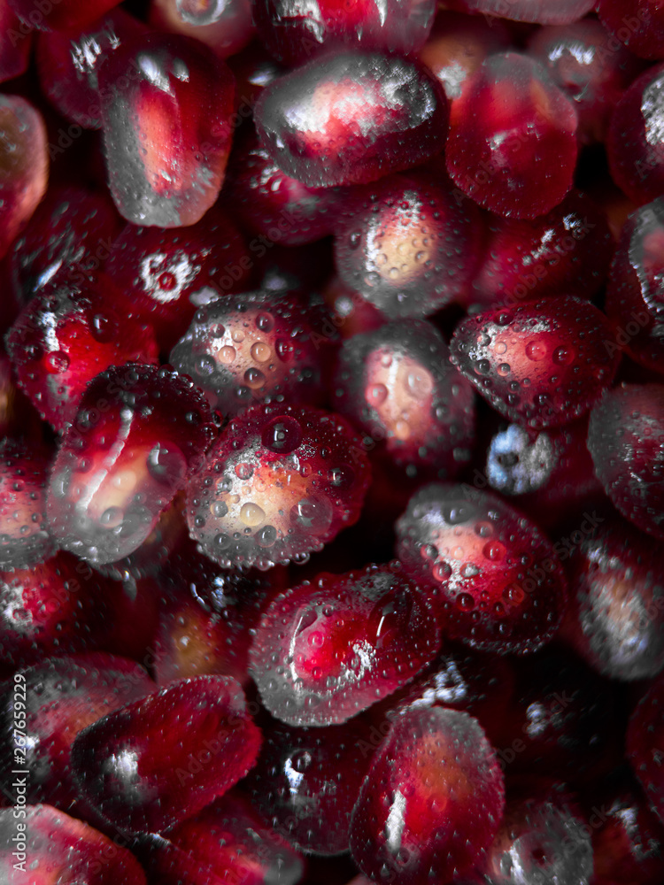 Top view of fresh pomegranate seeds with water droplets. Top view of fresh pomegranate seeds with water droplets.