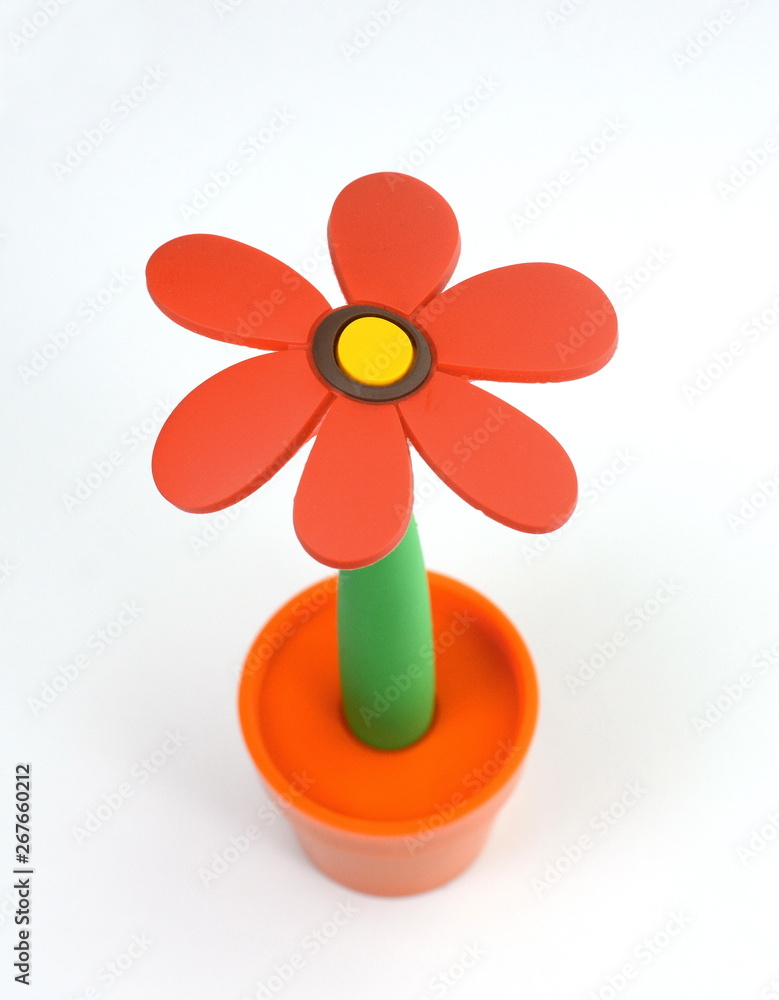 Beautiful soft plastic flowers in a flower pot isolated on a white background. Beautiful soft plastic flowers in a flower pot isolated on a white background.