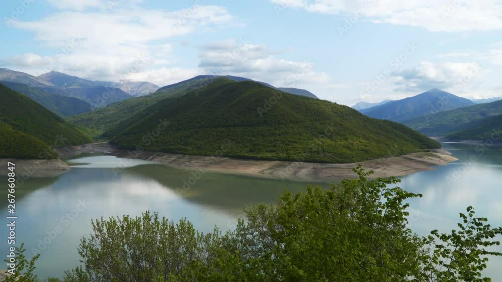 Mountains covered by forest against the sky with clouds. You can also see the lake Mountains covered by forest against the sky with clouds. You can also see the lake