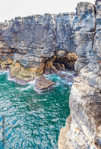View of a hole in a rock called the mouth of hell or Boca do Inferno in Cascais in Portugal