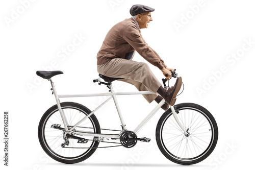 Senior man riding a tandem bicycle with legs up