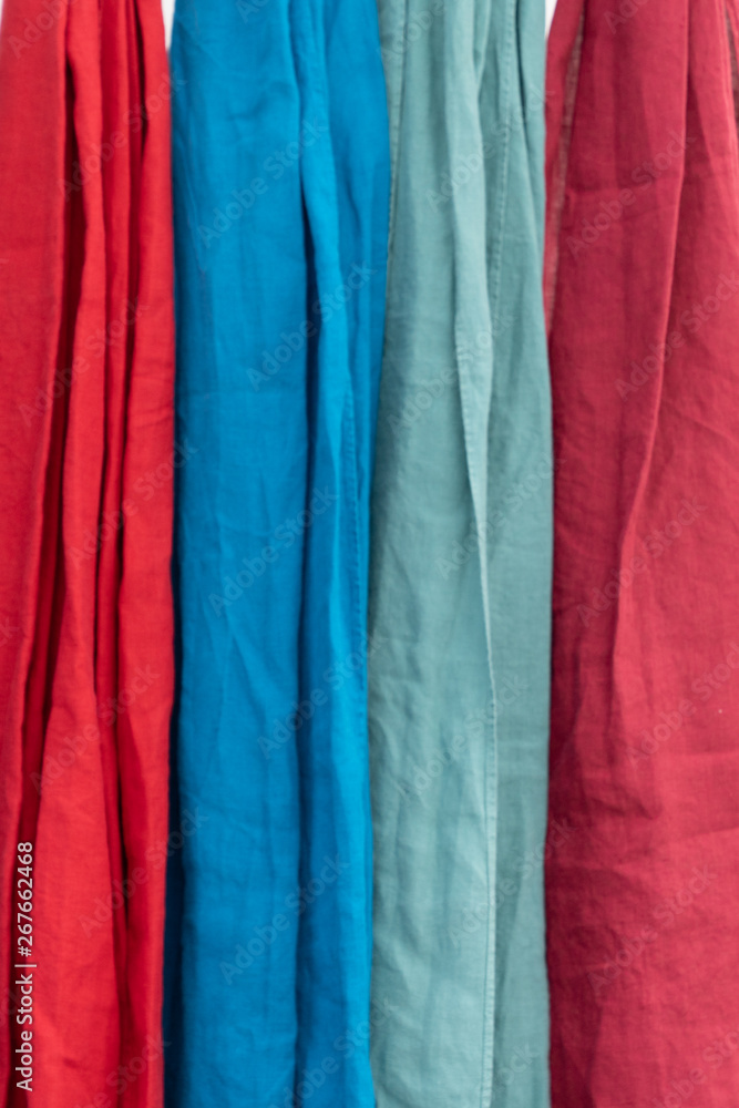red blue jaws of colorful fabric in the store