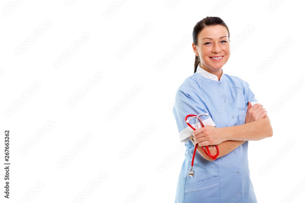 Portrait of Smiling brunette 30-35 years old woman in blue nurse uniform with Stethoscope on isolated white background with copy space left for text or design. Health Care concept Portrait of Smiling brunette 30-35 years old woman in blue nurse uniform with Stethoscope on isolated white background with copy space left for text or design. Health Care concept