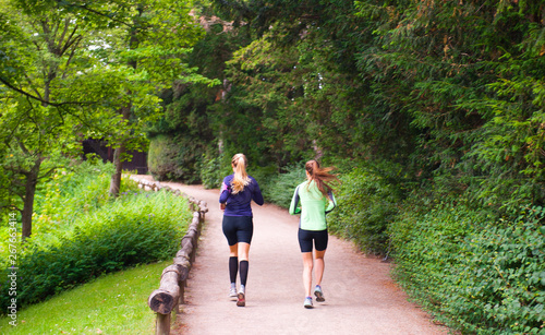 Two girls running in the park in Copenhagen