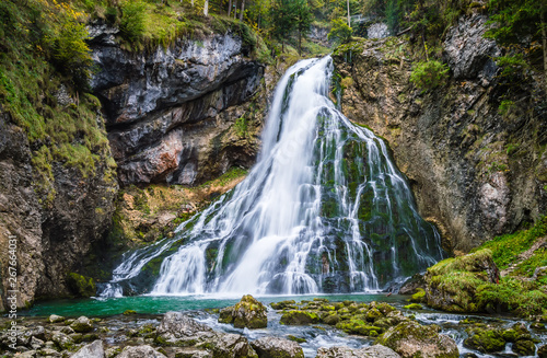 Fototapeta Naklejka Na Ścianę i Meble -  Gollinger Waterfall in Golling an der Salzach near Salzburg, Austria. Stunning view of cascade waterfall over mossy rocks in the Alps with long exposure