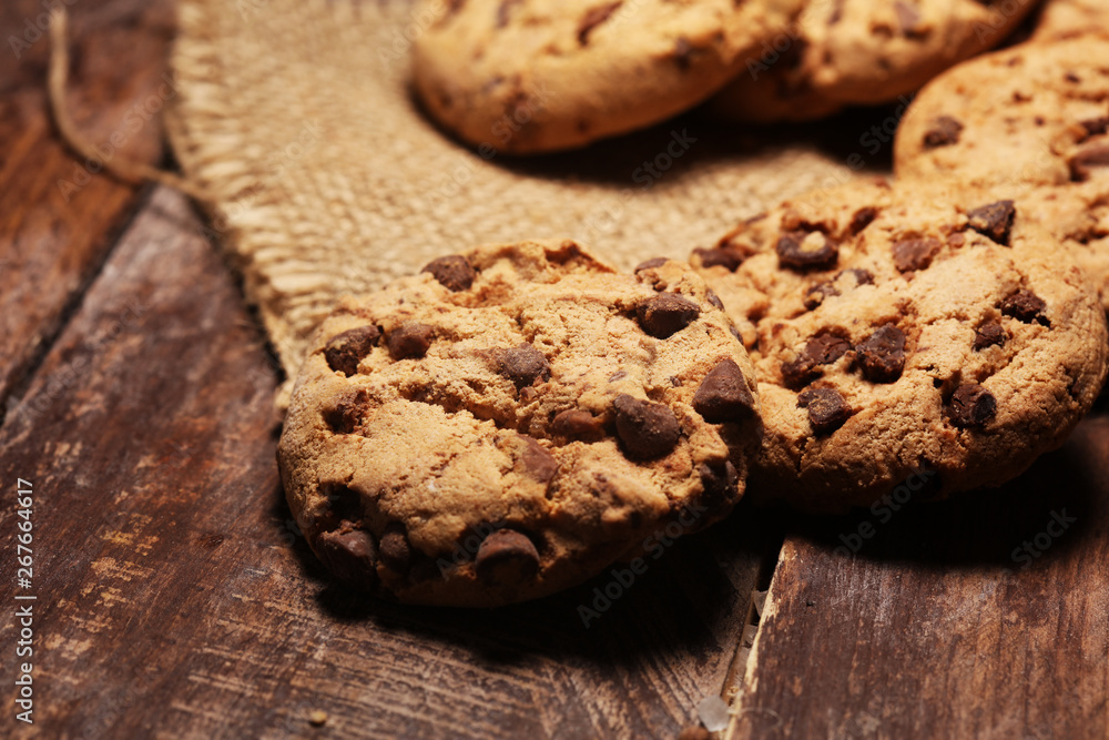 Fototapeta premium Chocolate cookies on wooden table. Chocolate chip cookies shot very delicious