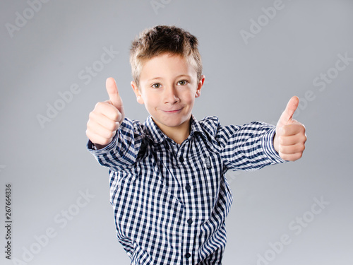 Photos Little boy with thump up gesture