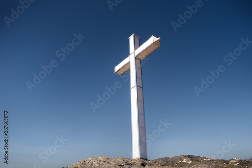 large white cross against a blue sky
