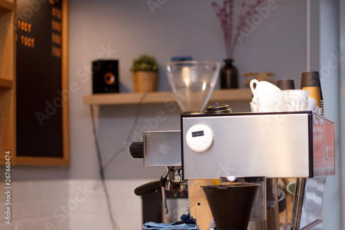 coffee machine grinding coffee interior of the coffee shop