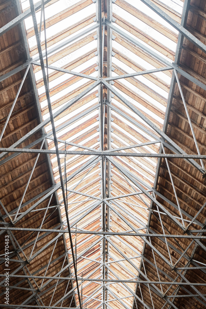 Fototapeta premium Wooden roof in the hangar for horses