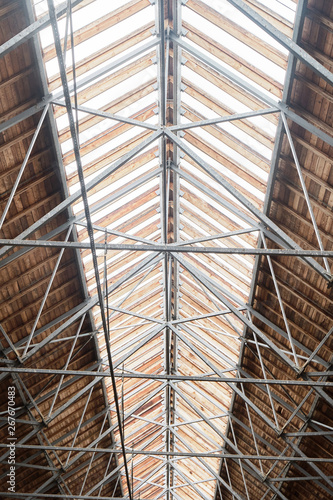 Wooden roof in the hangar for horses