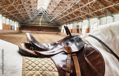Leather horse saddle closeup. For the rider