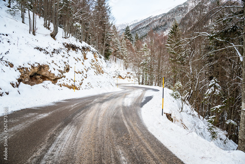 Winding winter road in the Alps. Majestic mountain landscape in winter.