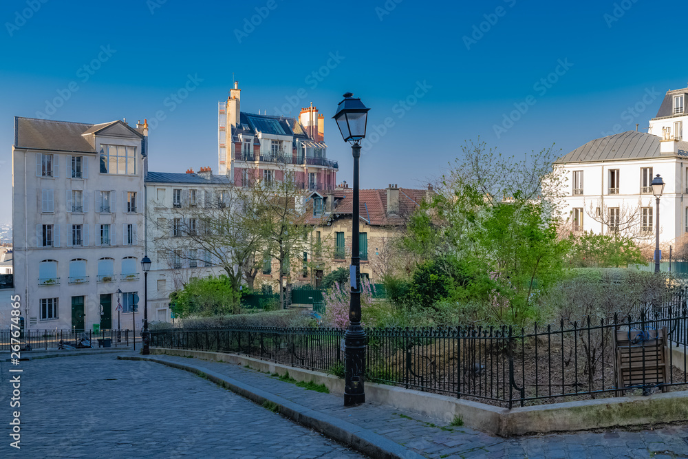 Montmartre in Paris, a very romantic parisian street and square with a vintage lamppost 