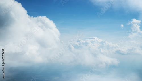 Dramatic blue sky background with white clouds