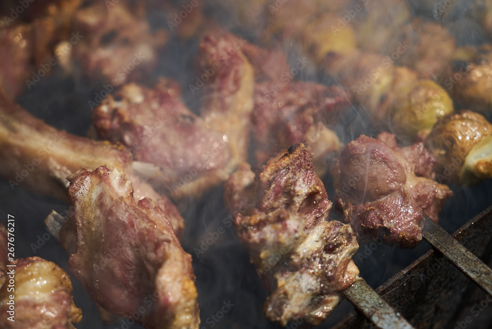 Grilled shish kebab with vegetables. BBQ grill with lamb meat and potatoes Grilled shish kebab with vegetables. BBQ grill with lamb meat and potatoes