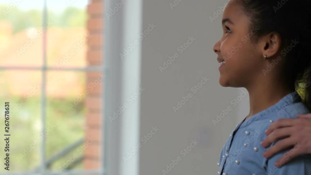 Close-up of joyful mixed race girl taking house keys from hands of real estate agent. Broker giving keys from purchased house to adorable little homeowner, thanking him, and shaking hands with parents Close-up of joyful mixed race girl taking house keys from hands of real estate agent. Broker giving keys from purchased house to adorable little homeowner, thanking him, and shaking hands with parents