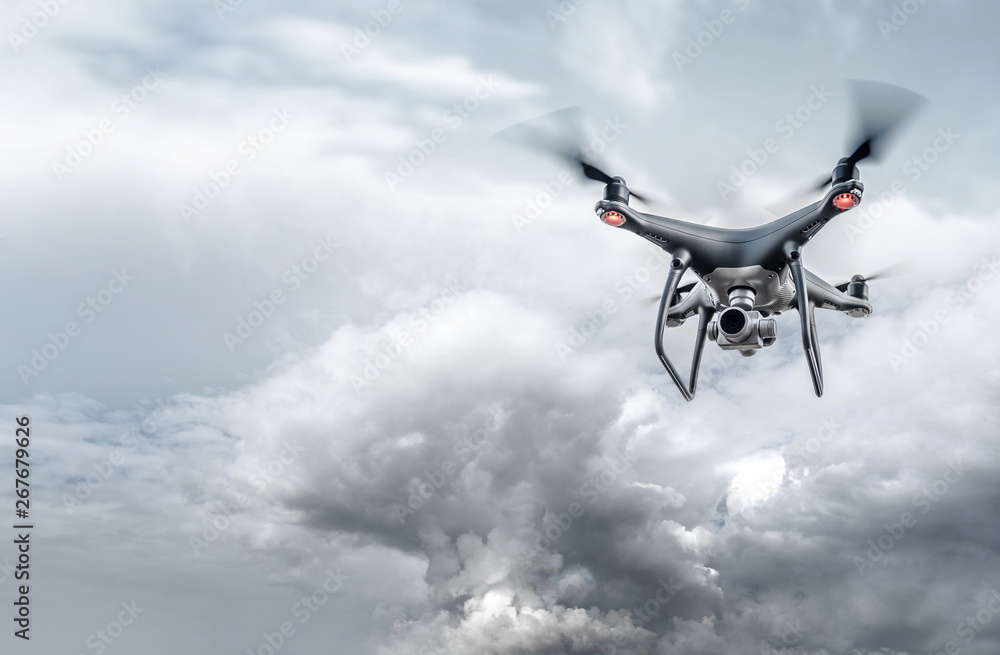 Drone in the sky. Unmanned aerial vehicle flying in the air. Drone in the sky. Unmanned aerial vehicle flying in the air.