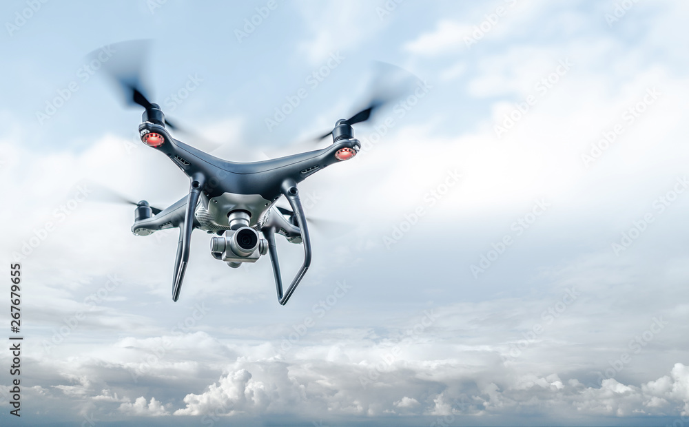Drone in the sky. Unmanned aerial vehicle flying in the air. Stock ...