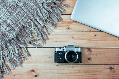 Old camera, a blanket and laptop