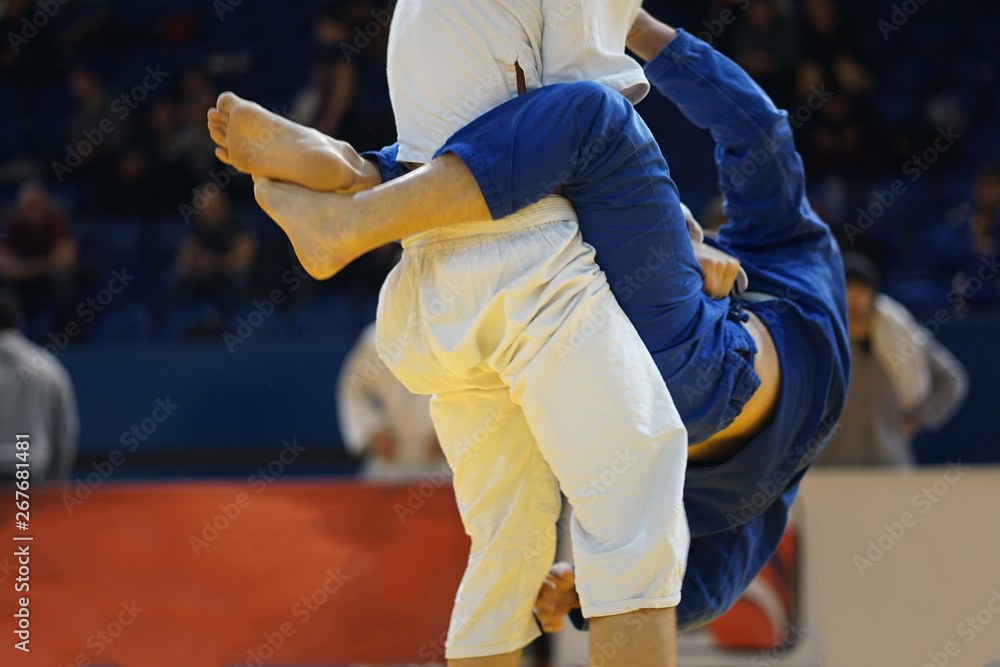 Pulling guard bjj Brazilian Jiu jitsu at the tournament fighters attacking passing stand up Pulling guard bjj Brazilian Jiu jitsu at the tournament fighters attacking passing stand up
