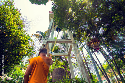 monk ringing the bell 