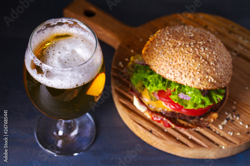 Glass of beer and burger. Beer and food concept