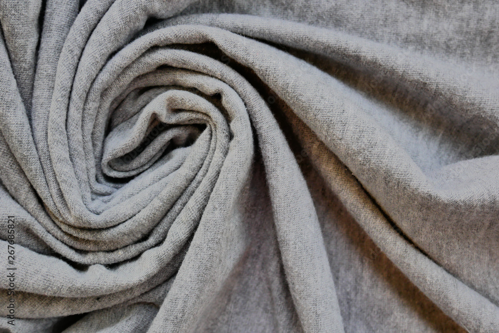 Abstract textile backdrop. Fabric texture waves in spiral shape. Abstract textile backdrop. Fabric texture waves in spiral shape.