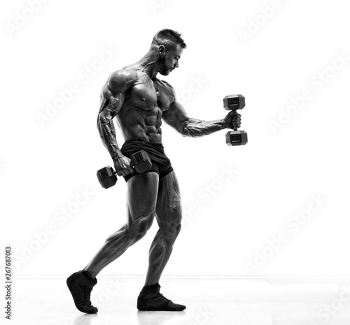 Handsome Young Body Builder Exercise With Dumbbells. Black and White Image