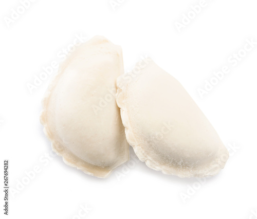 Tasty raw dumplings on white background, top view