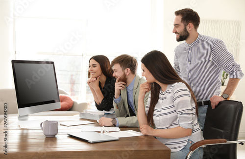 Group of colleagues using video chat on computer in office. Space for text