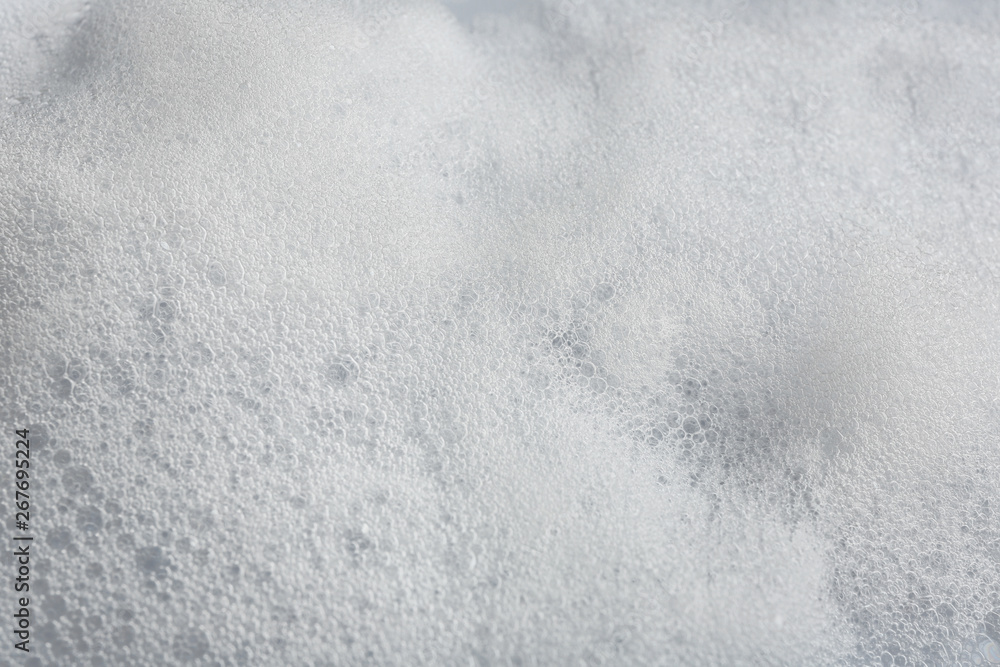 Obraz premium Soft white soap foam as background, closeup