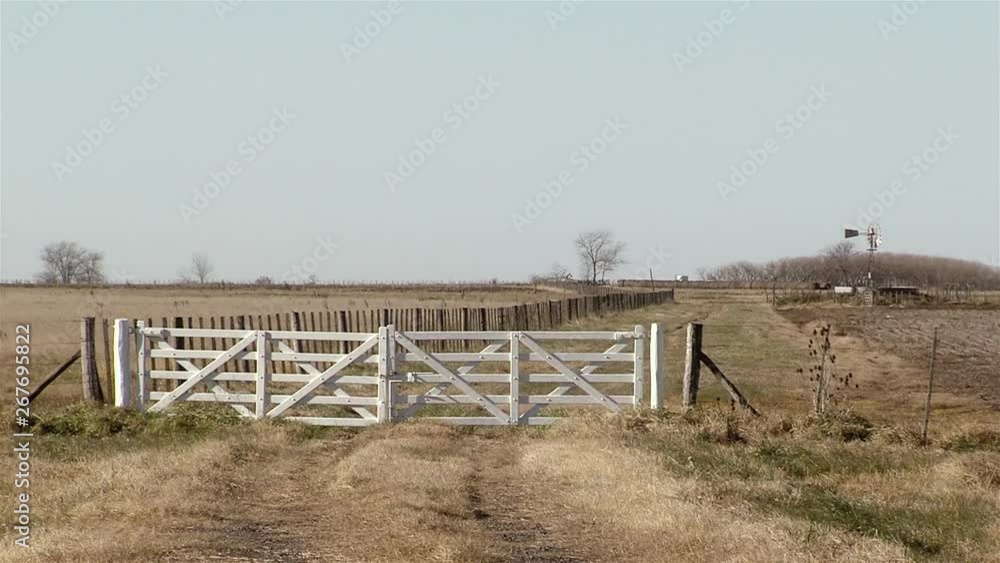 Wooden Gate On A Rural Landscape In La Pampa Province, Argentina. Wooden Gate On A Rural Landscape In La Pampa Province, Argentina.