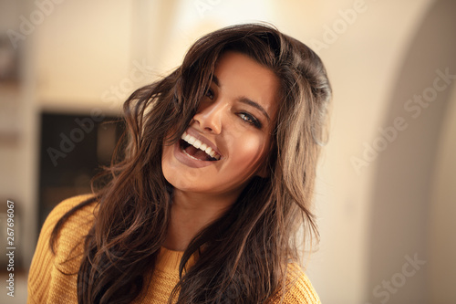 Young brunette woman with amazing smile.
