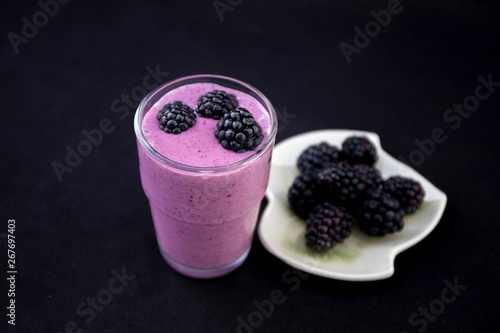 Acai Smoothie with fresh blackberries in the glass cup