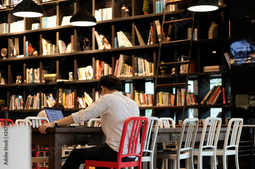 student reading books in the library